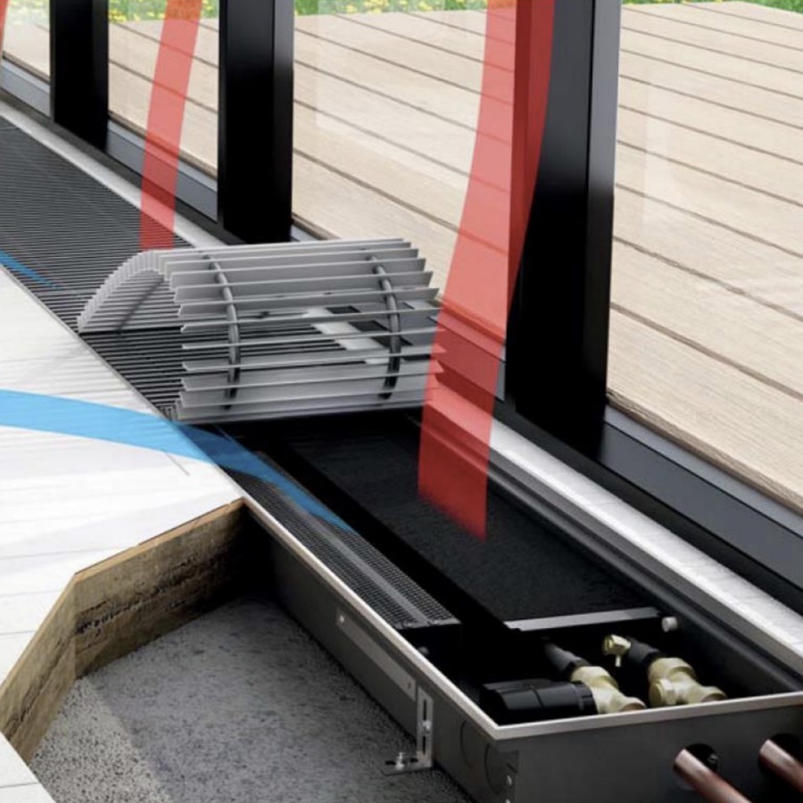 Cutaway of a perimeter trench heater installed beneath floor-to-ceiling glazing